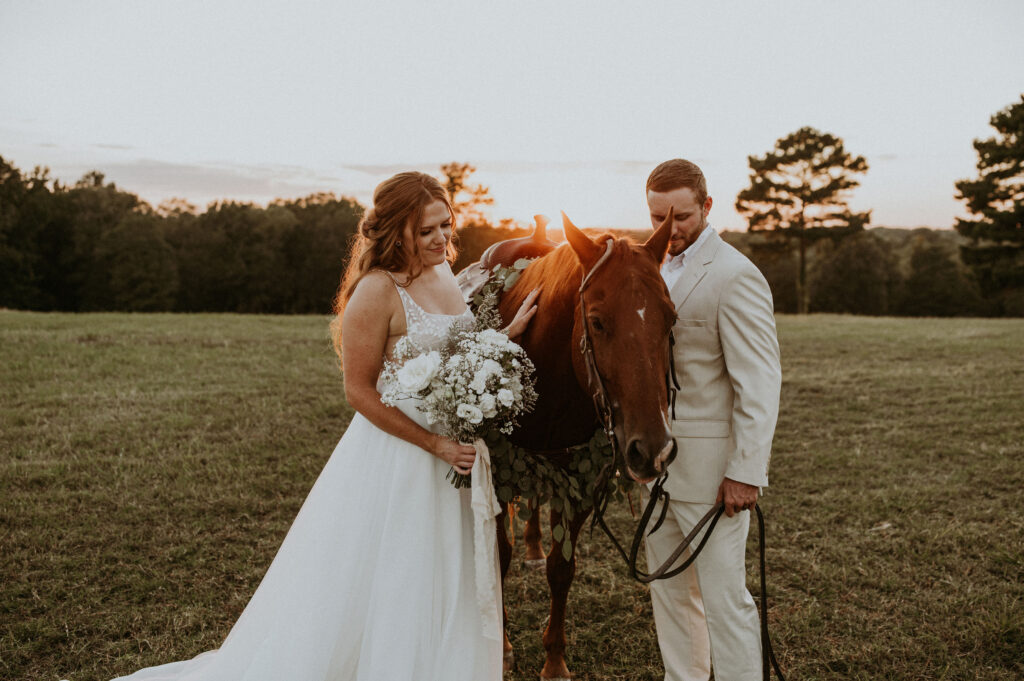 couple posing for their wedding photos on a ranch
