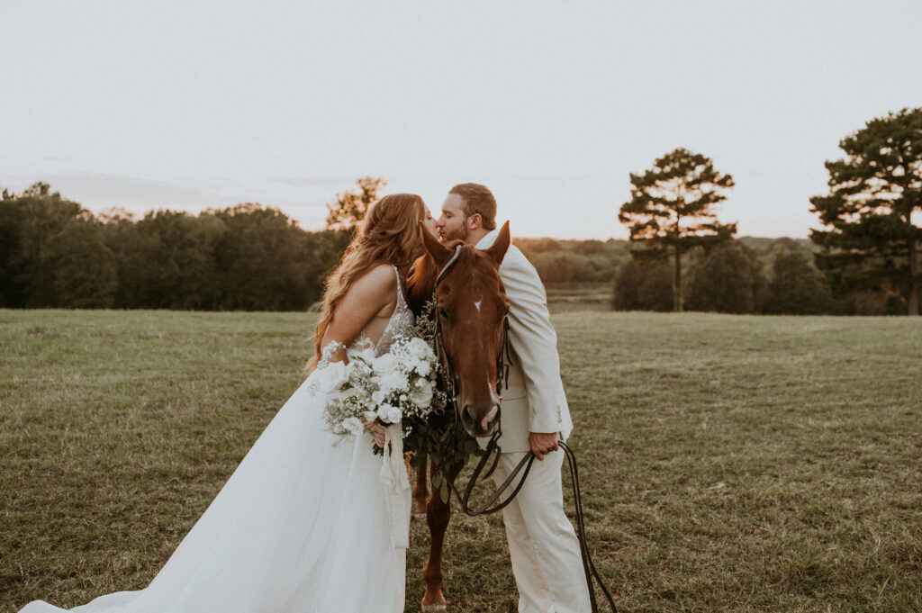 couple posing for their wedding photos on a ranch