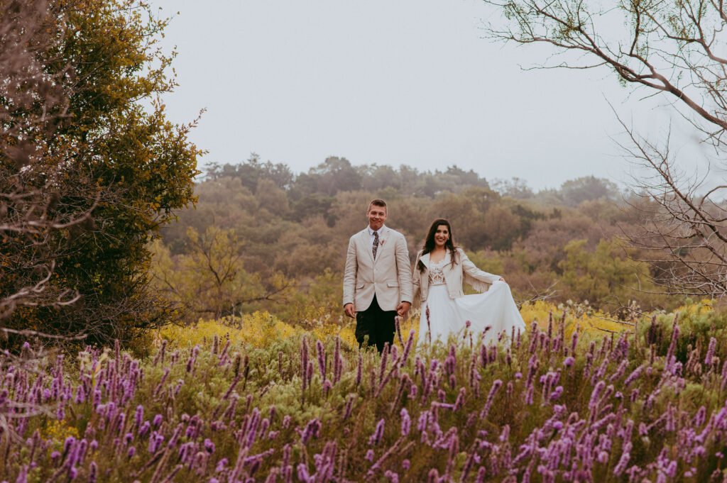 newlyweds posing for outdoor wedding photos

