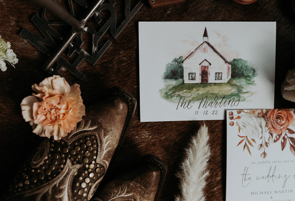 a chapel drawing, cowboy boots and flowers the couple wedding details