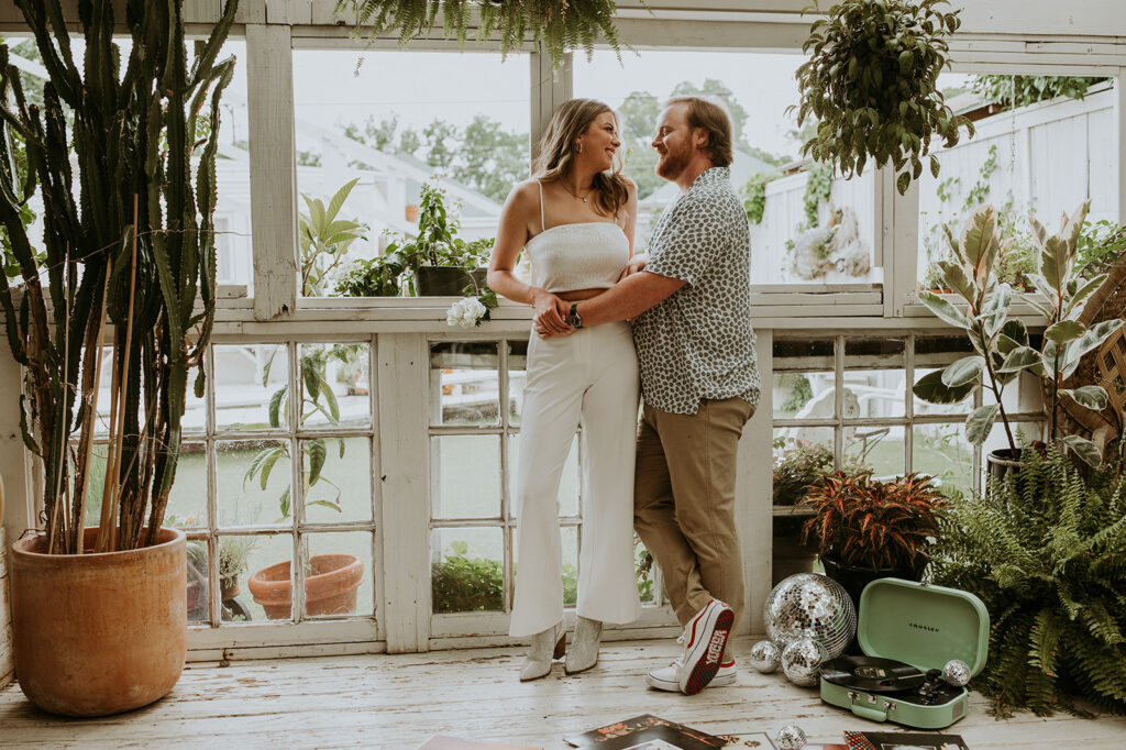 Couples at house of dirt during their unique engagement session