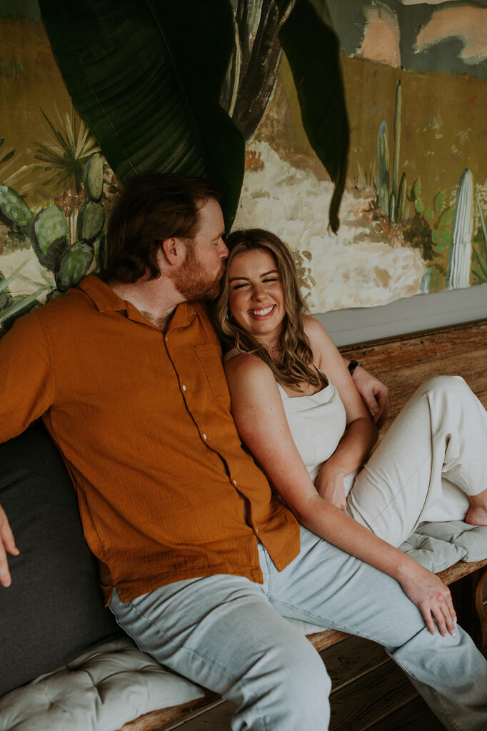 Couple seating in a bench during their engagement photoshoot