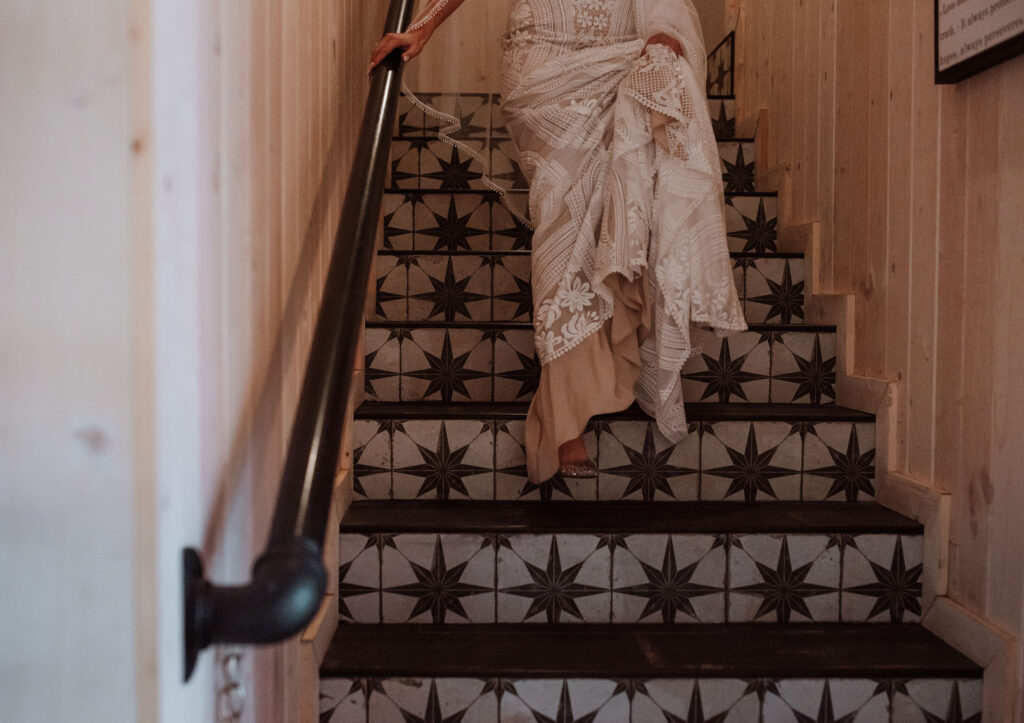 close up shot of the bride walking down the stairs