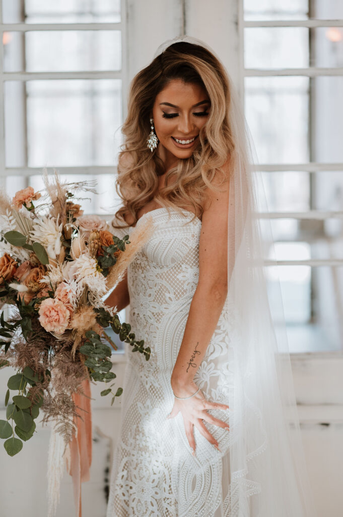 Bride wearing a beautiful gown and her bouquet