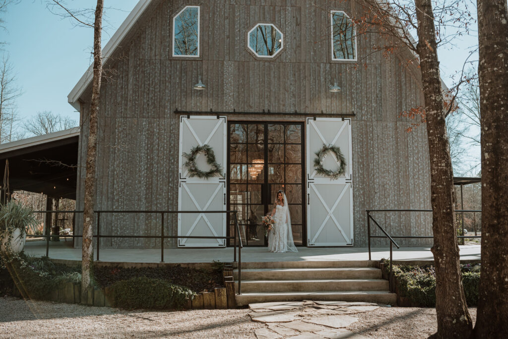 Bride in front of their reception during her Romantic winter elopement