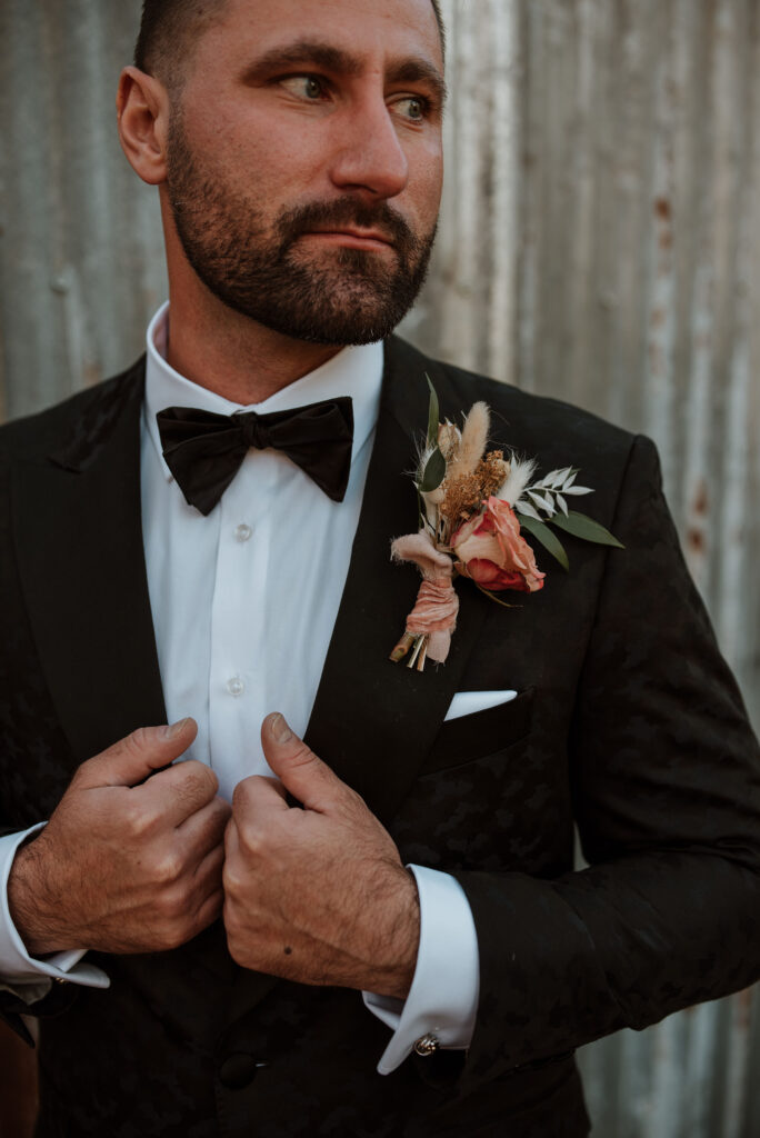 close up shot of the grooms tuxedo