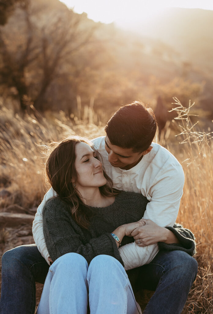 couple looking at each other during their adventurous engagement session 