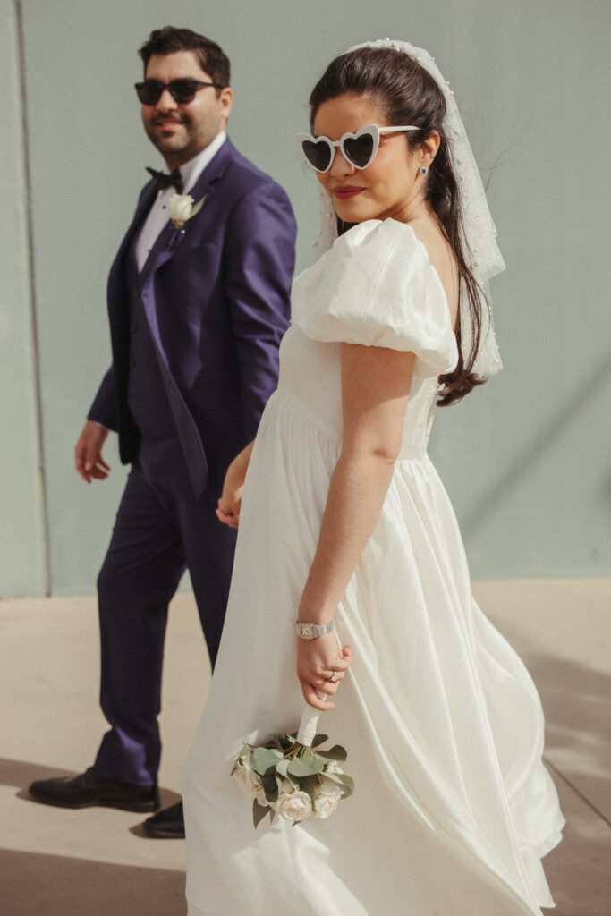 bride and groom holding hands walking at downtown el paso
