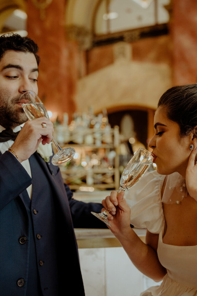 couple drinking champagne at their reception