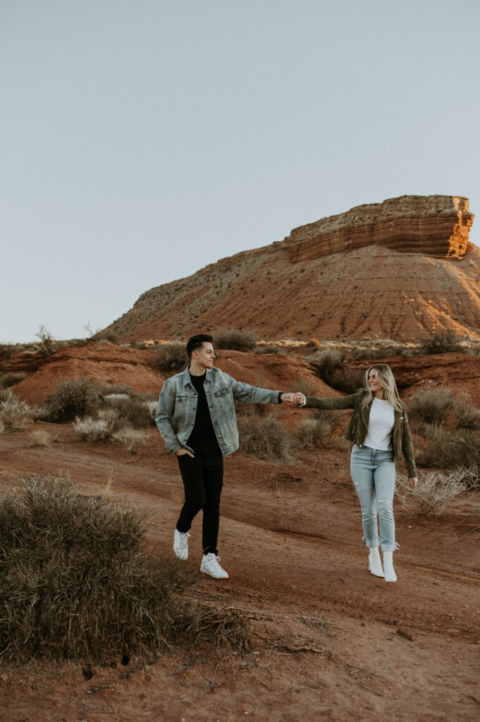 couple dancing at zion national park during their adventure engagement session