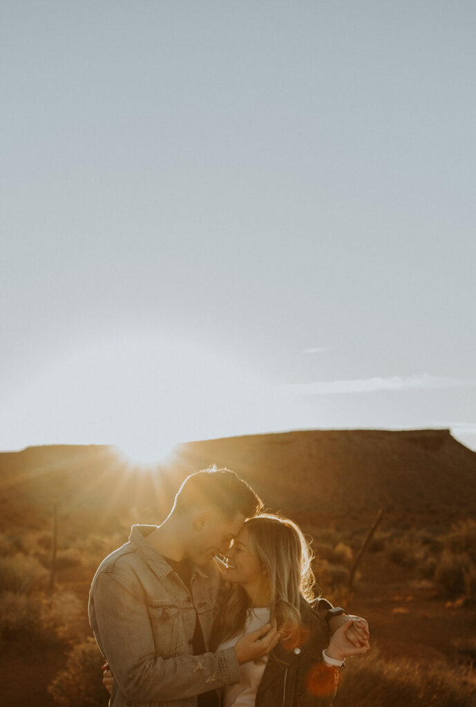 beautiful couple with the sunset in the background