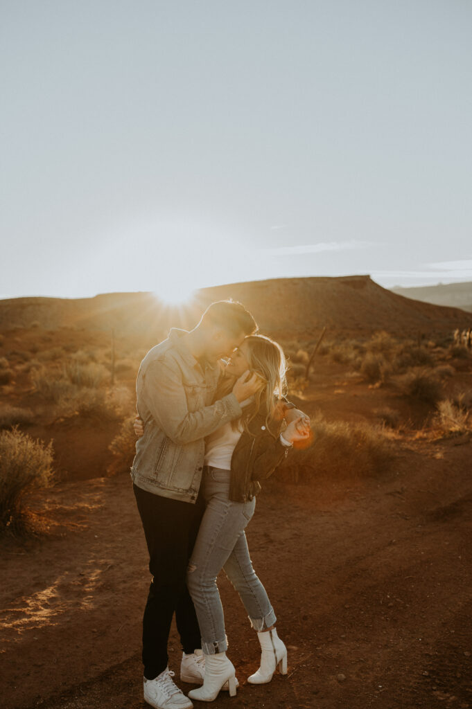 couple kissing during sunset 