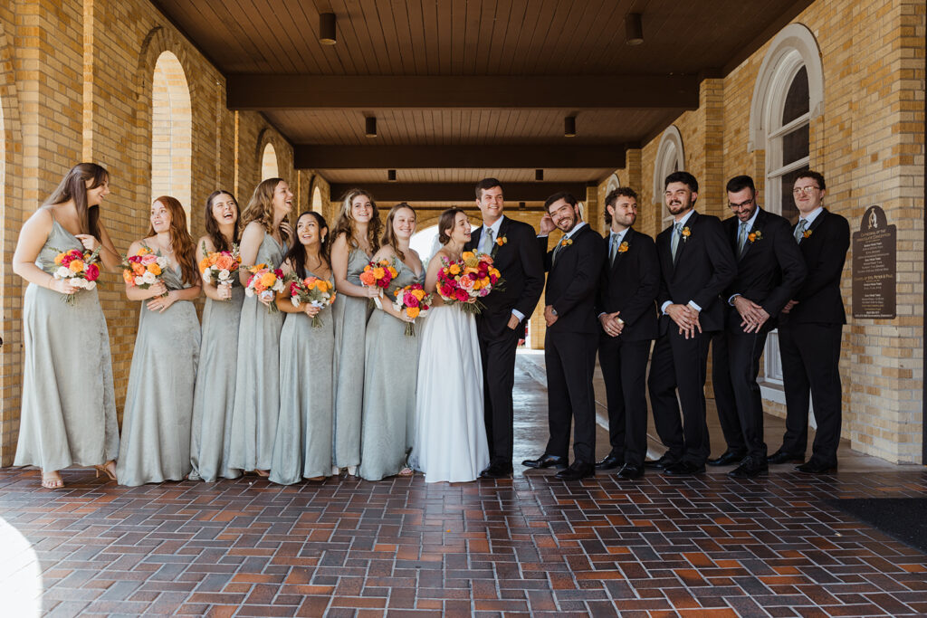 bride and groom with their bridesmaids and groomsmen at their luxurious wedding day
