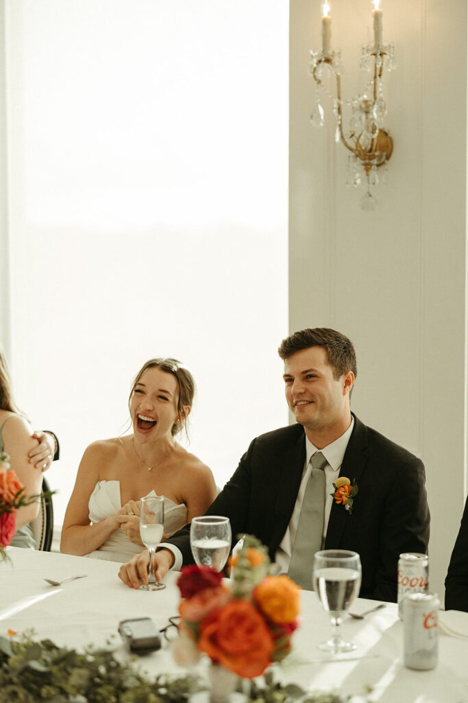 bride and groom laughing at their luxurious wedding day 