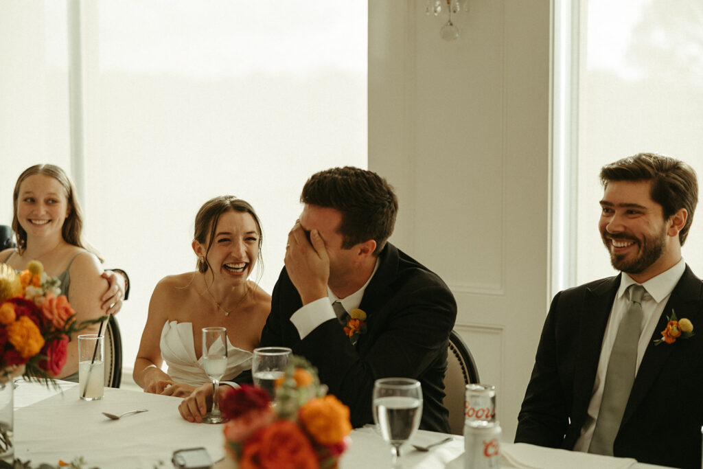 bride and groom laughing at their wedding day