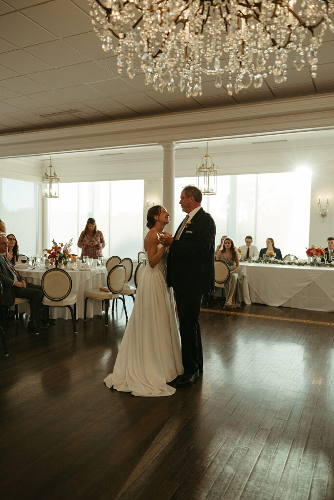 bride dancing with her dad at her luxurious wedding day