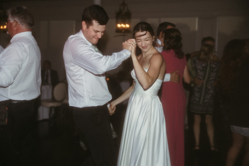 bride and groom dancing at their wedding reception 