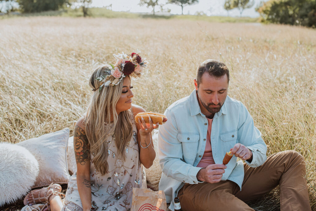 couple eating at their unique engagement session