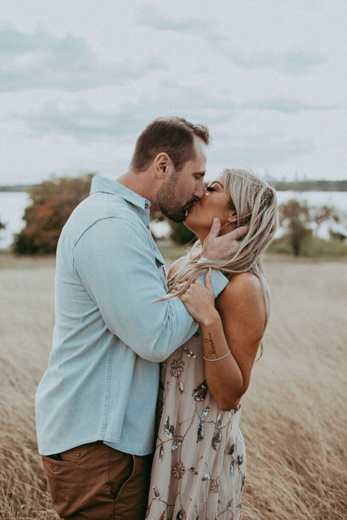 couple kissing at their unique engagement session 