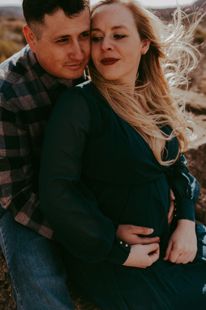 couple at their maternity photoshoot location 