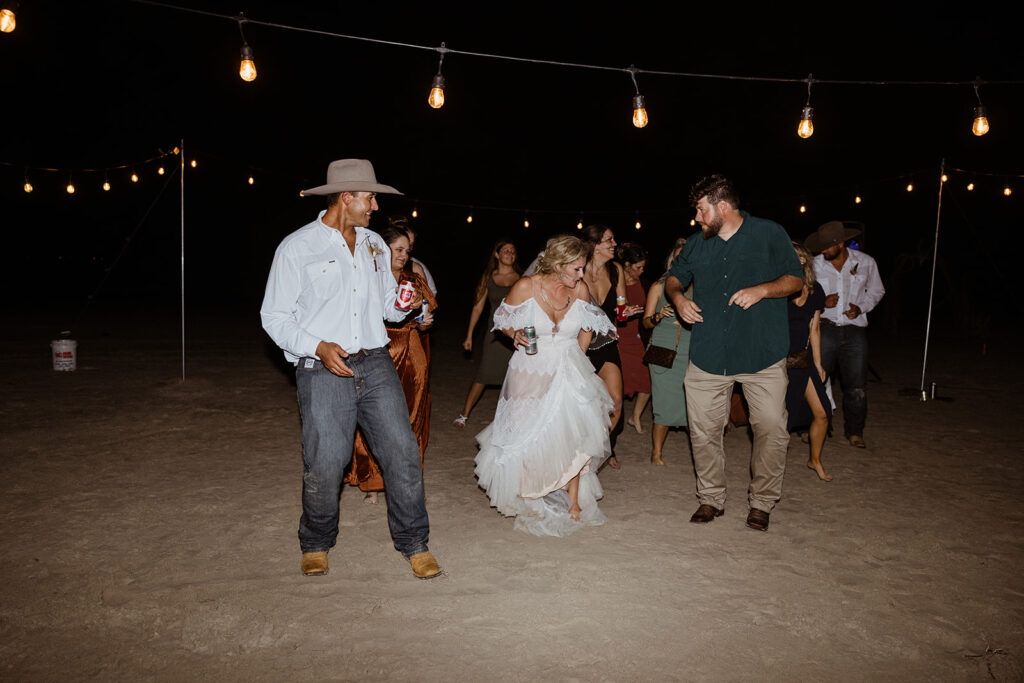 bride and groom dancing with their guests at their texas coast wedding