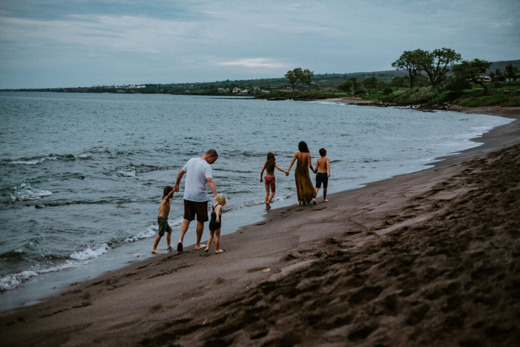 family walking around the beach
