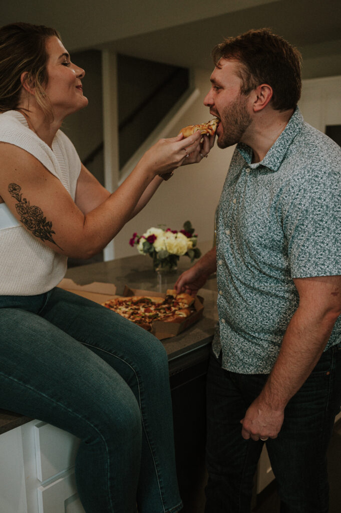 cute couple smiling and eating pizza | at home couples session