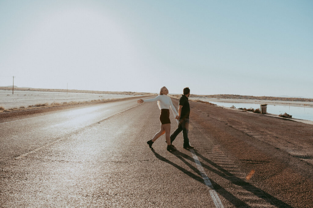 couple walking around at their adventurous engagement session 