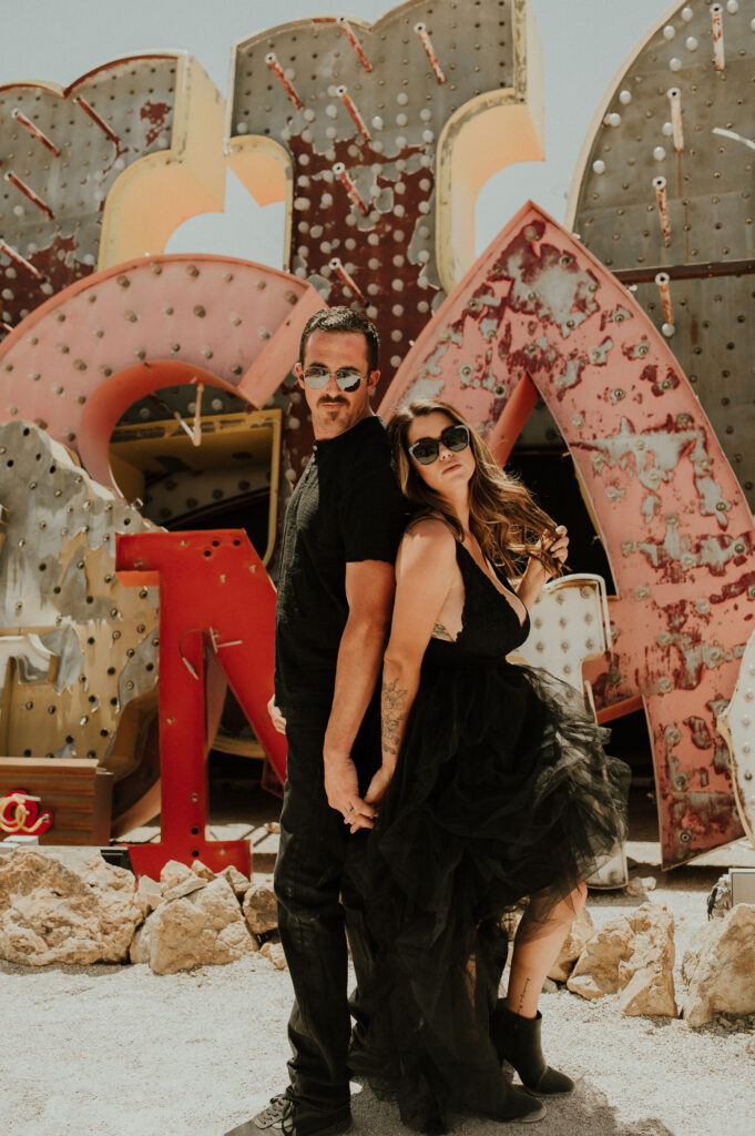 couple at the neon museum during their photoshoot